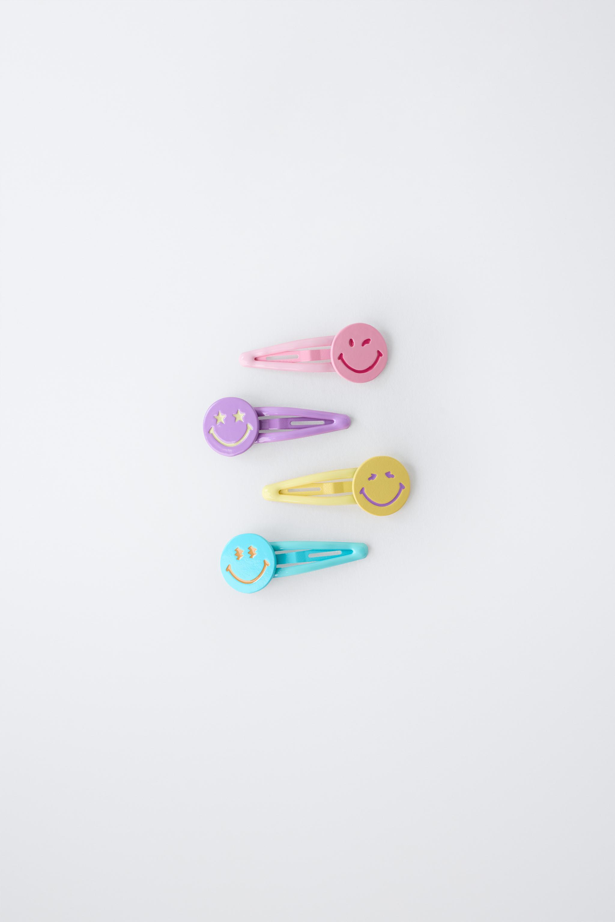 LOT DE QUATRE PINCES SMILEYWORLD ®